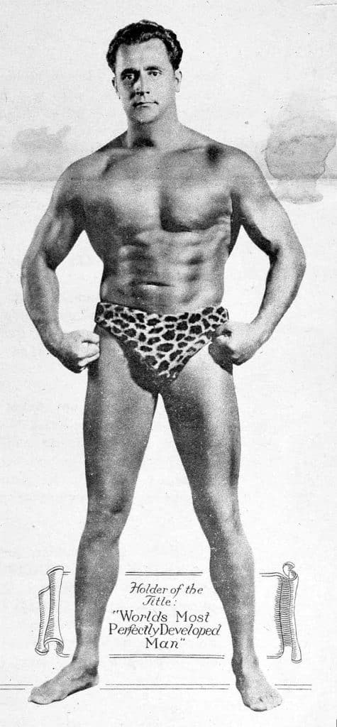 Photo of Charles Atlas flexing his muscles.